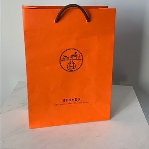 Hermès signature orange shopping bag. 8.5” X 11.5”